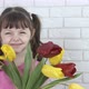 A child with tulips.
