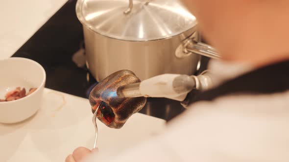 The Cook Burns the Sweet Pepper with a Gas Cylinder alt