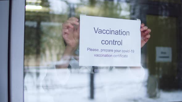 Woman in Mask Putting Up Entry Covid Requirements International Coronavirus Measures Vaccination alt