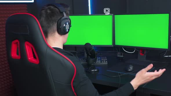 A young Caucasian streamer sits down in a chair and starts a podcast alt