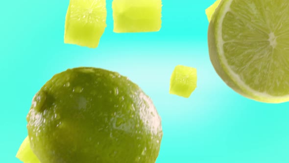 Lime with Slices Falling on Turquoise Background alt