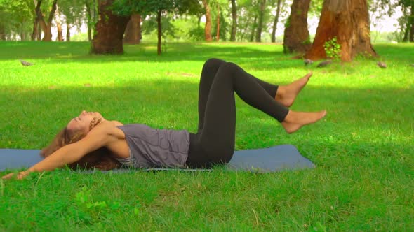Caucasian Female Doing Yoga Outdoor