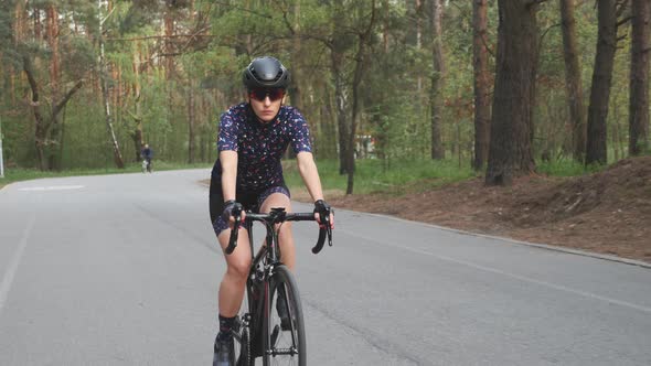 Woman rides bike alt