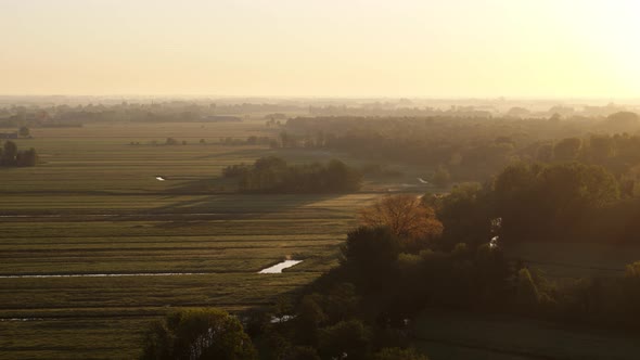 Beautiful sunrise aerial over farmlands Krimpenerwaard, Netherlands. alt