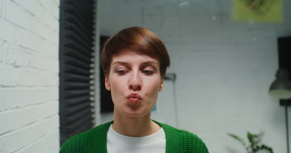 Young Woman is Engaged in Planning Using Glass Board Working Alone in Office alt