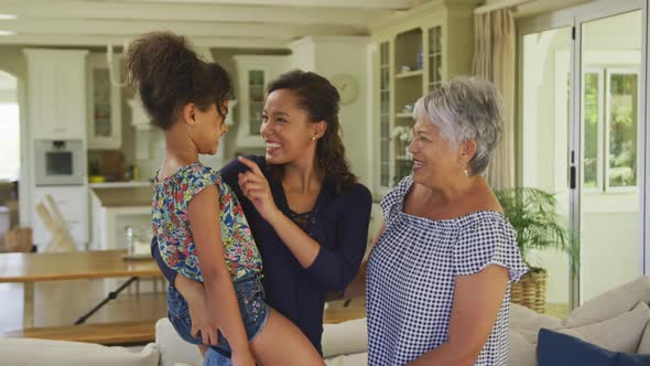 Multi-generation family spending time together at home alt