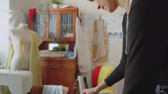 Woman Ironing Fabric for Sewing alt