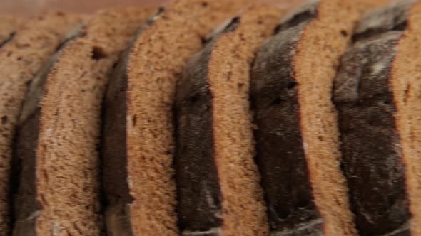 Close-up of Fresh Wholegrain Bread. Sliced Organic Bread at Cutting Board.