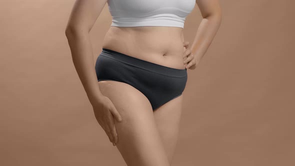 Full Figure Caucasian Woman in Underwear Put Cream and Appreciate Her Body