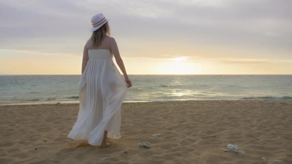 People on Ocean Beach Happy Female Silhouette Walking at Golden Sunset Hawaii alt