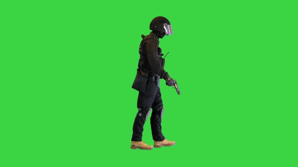 Counter Terrorist Squad Fighter Walking with a Pistol in a Hand on a Green Screen Chroma Key alt