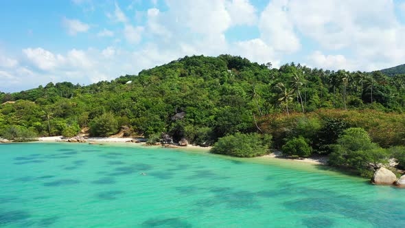 Beautiful wild tropical coast with secluded sandy beach, tropical palm forest and crystal clear turq alt