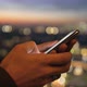 Beautiful Close-up on Female Hands Using Smartphone Shopping App at Amazing Bokeh Sunset City Lights - VideoHive Item for Sale