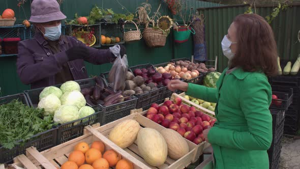 Buying Eggplants at the Market. 2 Shots. alt