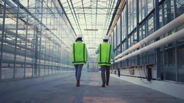 Portrait Engineers Walking in Factory Checking Safety Discussing Production alt