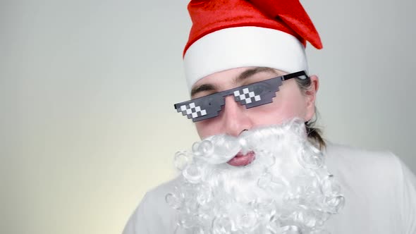 Dancing Swag Santa Claus in Funny Pixelated Sunglasses on White Background alt