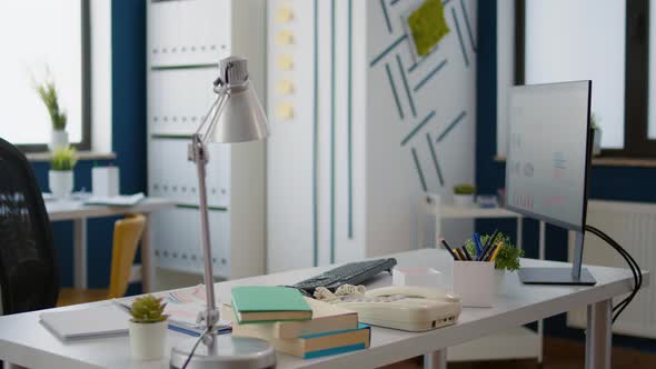 Empty Business Workspace with Office Supplies and Technology alt
