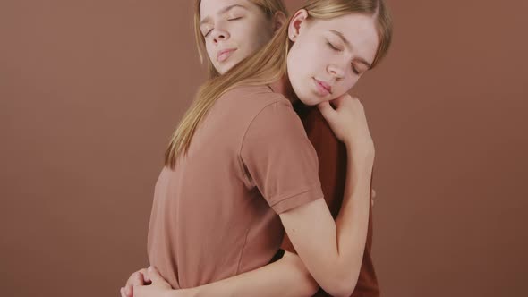 Twin Girls Embracing alt