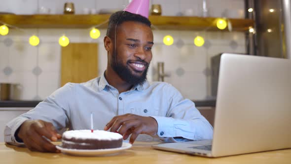 Afroamercan Celebrating Birthday Through Video Call Virtual Party with Friends alt