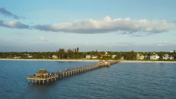 Naples Beach and Fishing Pier at Sunset, Florida. alt