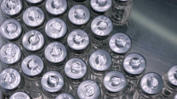 Pharmaceutical Production Line - Conveyor Belt with Empty Glass Bottles