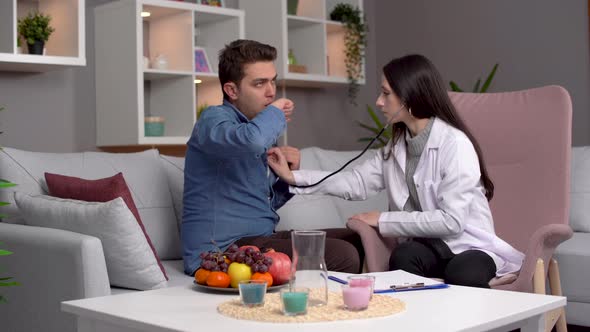 Doctor treating patient at home. alt