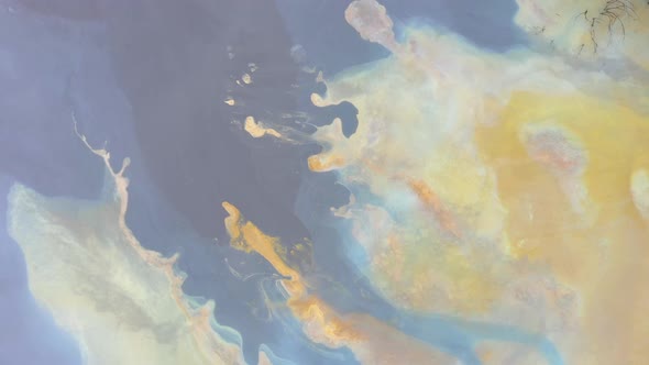 Flying Above Abstract Pattern of Colorful Mining Water and Mud alt
