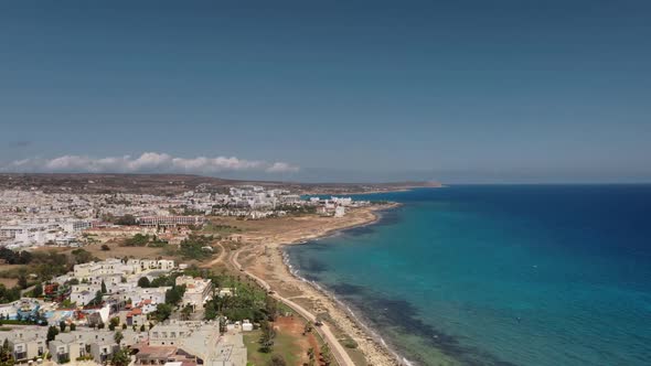 Aerial Drone Flight Over Resort City Coast on Cyprus Island