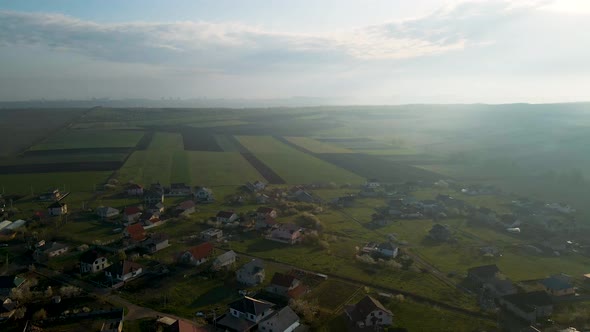 Aerial View of Countryside with Village and Agricultural Land on Beautiful alt