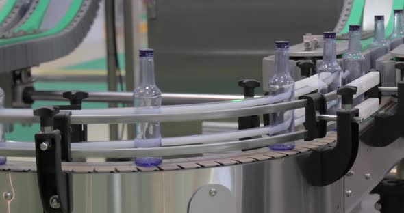 Bottles on Production Line Plant or Factory alt