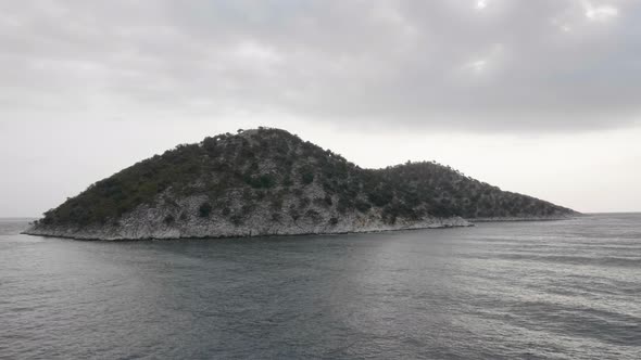 View of a Rocky Insland From a Cruise Ship alt