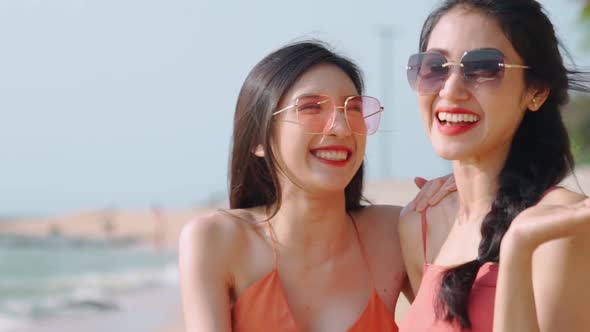 Two asian beautiful women feeling happy alt