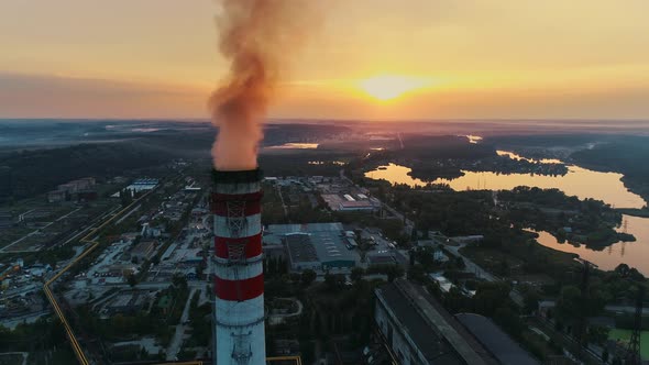 Aerial Drone Footage. Coal Fire Power Station at Sunset. Static Shot alt
