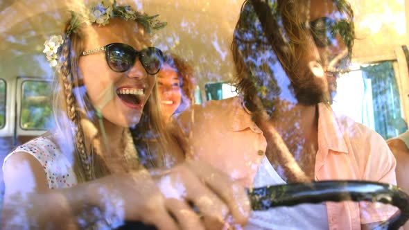 Hipster friends driving a van alt