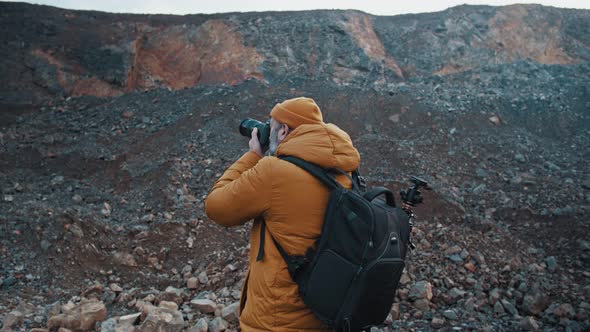 Following a Landscape Photographer While He Is Taking Pictures of Nature During Autumn alt