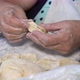 Senior Woman Hands Making Dumplings with Mashed Potato Stuffing - VideoHive Item for Sale