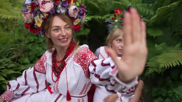 Beautiful Young Woman in Traditional Ukrainian Clothing and Little Pretty Girl in National Dress alt