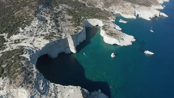 Aerial View Facing Down on Tropical Island Bay with White Rocks and Caves alt