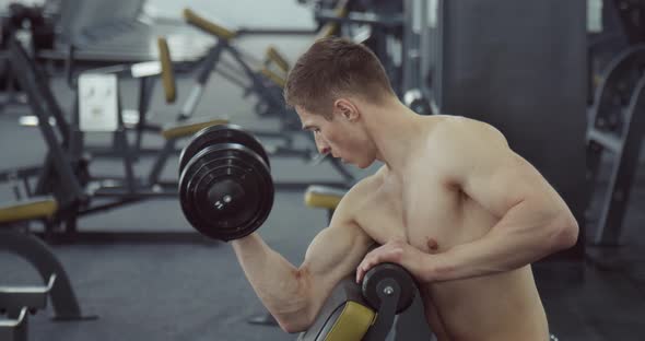 Man Doing Biceps Lifting Barbell