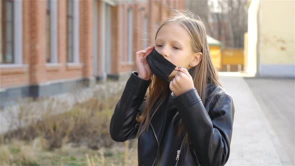 Girl Wearing a Mask Protect Against Coronavirus and Gripp alt