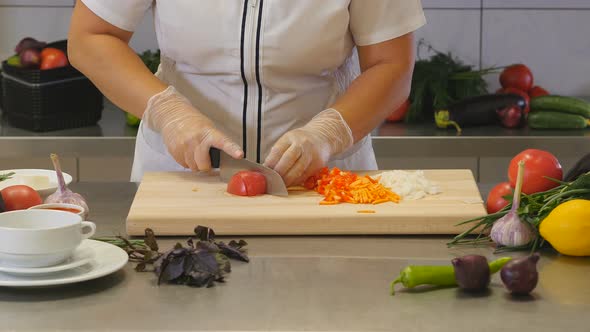Professional Chef Chopping Vegetable on Board