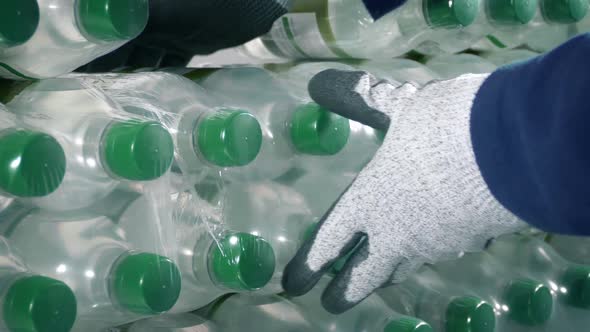 Pack Of Water Bottles Is Taken Or Loaded Into Stack alt