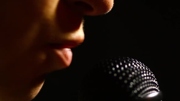 Woman singing to a microphone