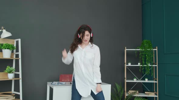 Businesswoman Singing and Dancing Taking a Break From Work and Having Fun alt