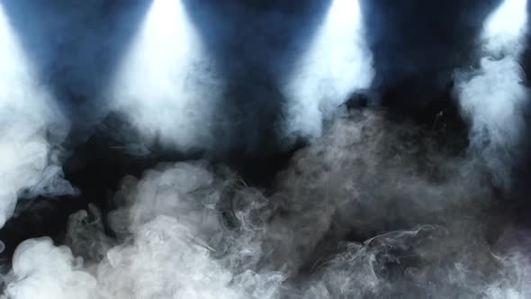 Background with Real Smoke and Spotlight at Dark Studio. Slow Motion. alt