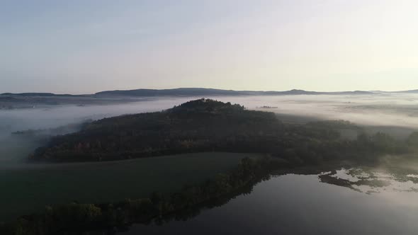 Aerial View of a Mountain with a Chapel on Top 4K