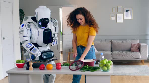 A Lady and a Robot Are Cooking and Trying Food alt