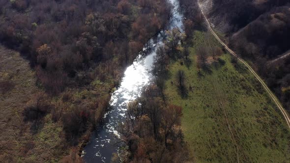 Aerial Shot of the Oskol River and Many Trees in Warm Sunny Weather in Dvurechansky Park, Kharkov alt