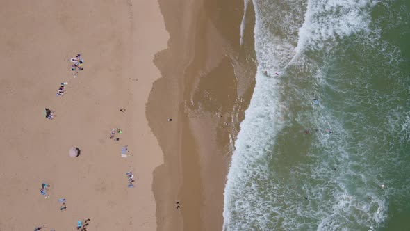 Aerial View People Sunbathing Beach