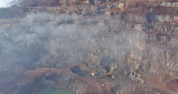 This Area Opencast Mining Quarry with of Machinery at Work of a Morning Fog Over Mountain alt